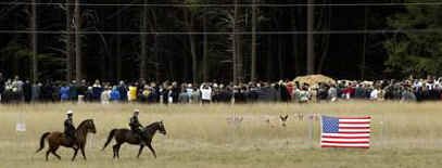 Police patrol Flight 93 crash site on September 11, 2002.