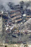 NYC Image  AP. In the aftermath of the September 11, 2001 terrorist attacks on the World Trade Center in New York City, firemen and rescue workers search for survivors, and extenguish flames in the massive rubble from the 09-11-2001 attack.