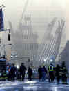 NYC Image  Reuters. In the aftermath of the September 11, 2001 terrorist attacks on the World Trade Center in New York City, firemen and rescue workers search for survivors, and extenguish flames in the massive rubble from the 09-11-2001 attack.