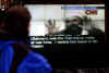 Click on the December 13th TV broadcast photo of the Osama bin Laden videotape for a larger image.