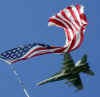 Click on the November 17th photo of a US FA18 jet flying over the USS Theodore Roosevelt for a larger image.