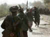 Click on the November 24th photo of Northern Alliance troops marching in Konduz province for a larger image.