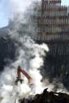 Thirty days after the collapse of the World Trade Center twin towers smoke continues to rise from the debris.