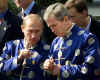 Click for a larger image. Russian President Putin and U.S. President Bush talk at APEC Summit in Shanghai on October 21, 2001.